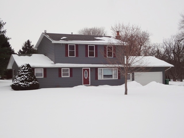 12920 Base Line Road Kingston, IL 60145 - Photo 1 of 25 a front view of a house with a yard