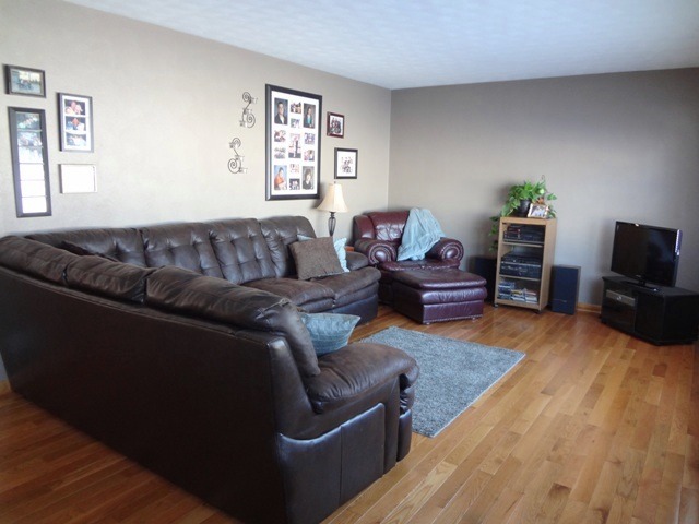 12920 Base Line Road Kingston, IL 60145 - Photo 2 of 25 a living room with furniture and a flat screen tv