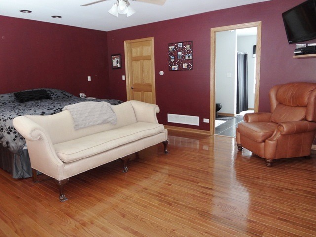 12920 Base Line Road Kingston, IL 60145 - Photo 11 of 25 a living room with furniture and a wooden floor