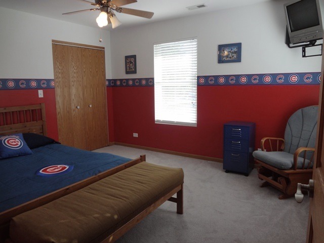 12920 Base Line Road Kingston, IL 60145 - Photo 14 of 25 a bedroom with a bed and a window