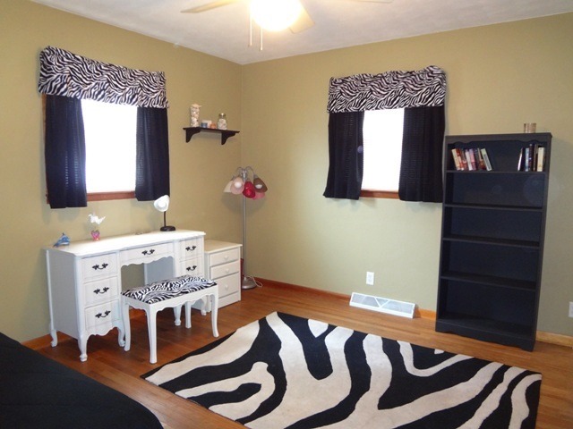12920 Base Line Road Kingston, IL 60145 - Photo 15 of 25 a bedroom with a bed and wooden floor