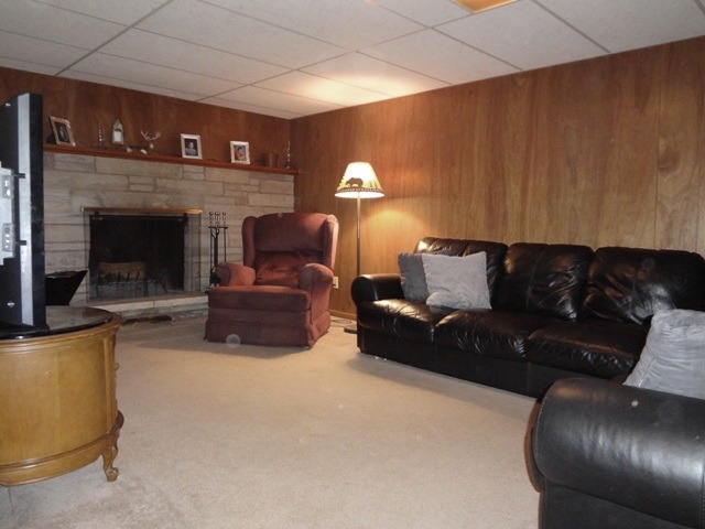 12920 Base Line Road Kingston, IL 60145 - Photo 19 of 25 a living room with furniture and a fireplace