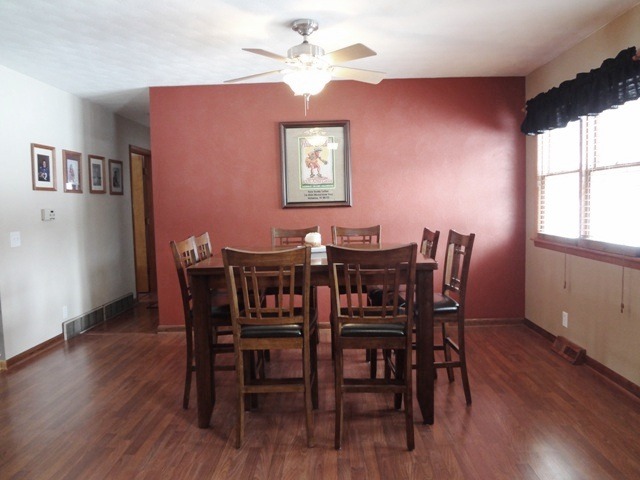 12920 Base Line Road Kingston, IL 60145 - Photo 6 of 25 a view of a dining room with furniture window and wooden floor