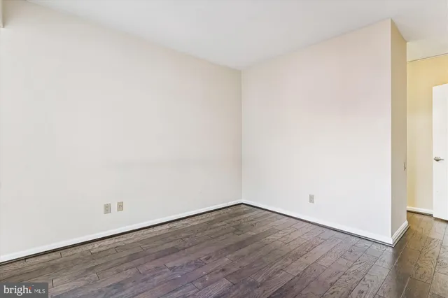an empty room with wooden floor