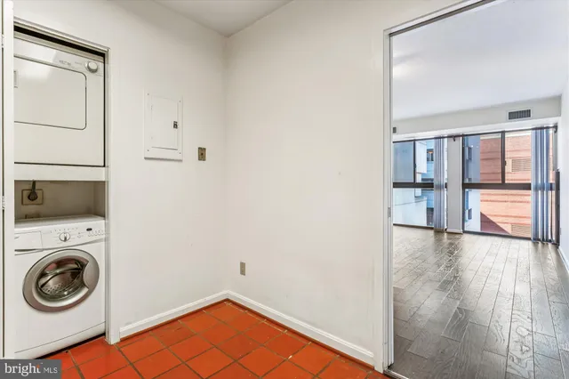 a view of a hallway with washer and dryer