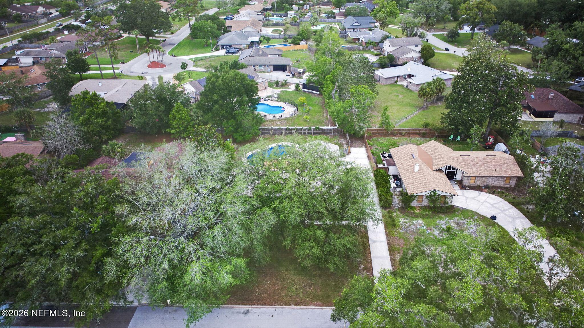 138 Ridgefield Court Orange Park, FL 32065 - Photo 55 of 64 an aerial view of residential house with outdoor space and trees all around