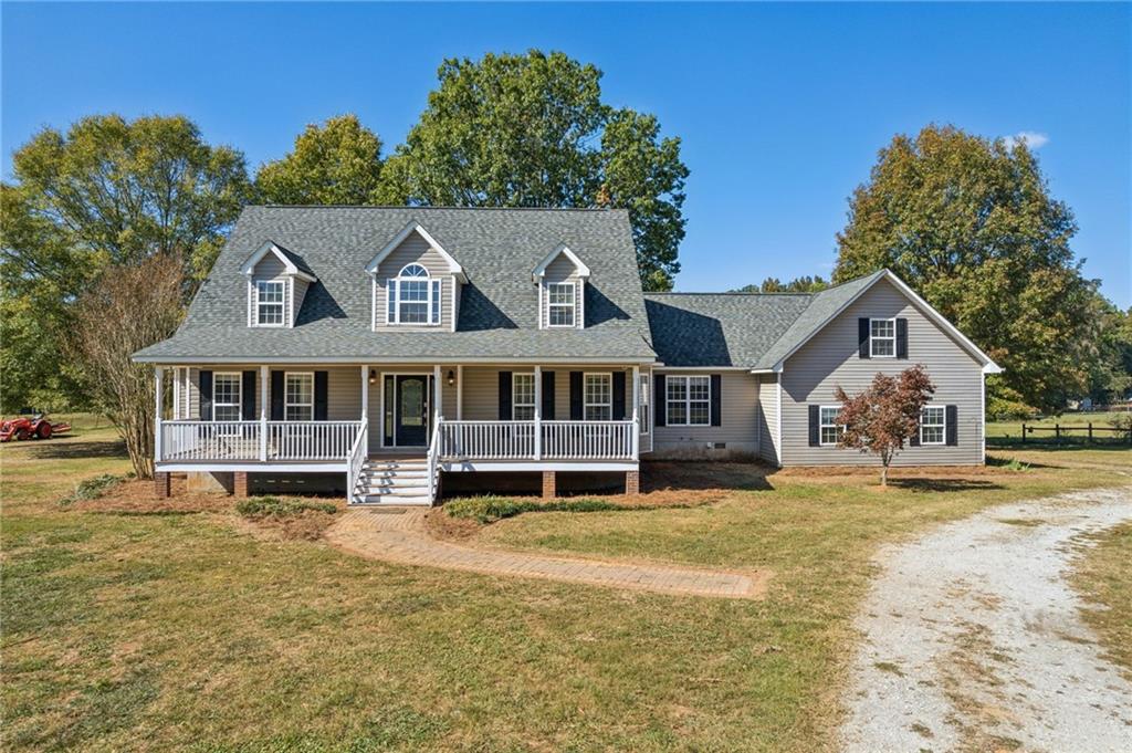 1201 Keencheefoonee Road Rutledge, GA 30663 - Photo 1 of 1 a front view of a house with a yard