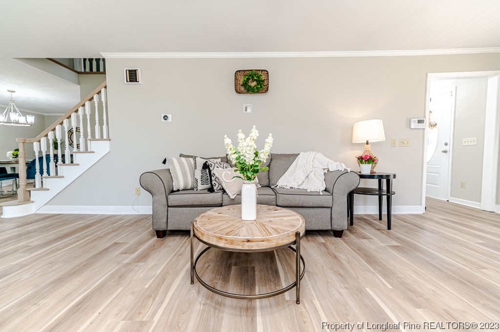 4286 Nicholson Road Cameron, NC 28326 - Photo 12 of 50 a living room with furniture and a wooden floor
