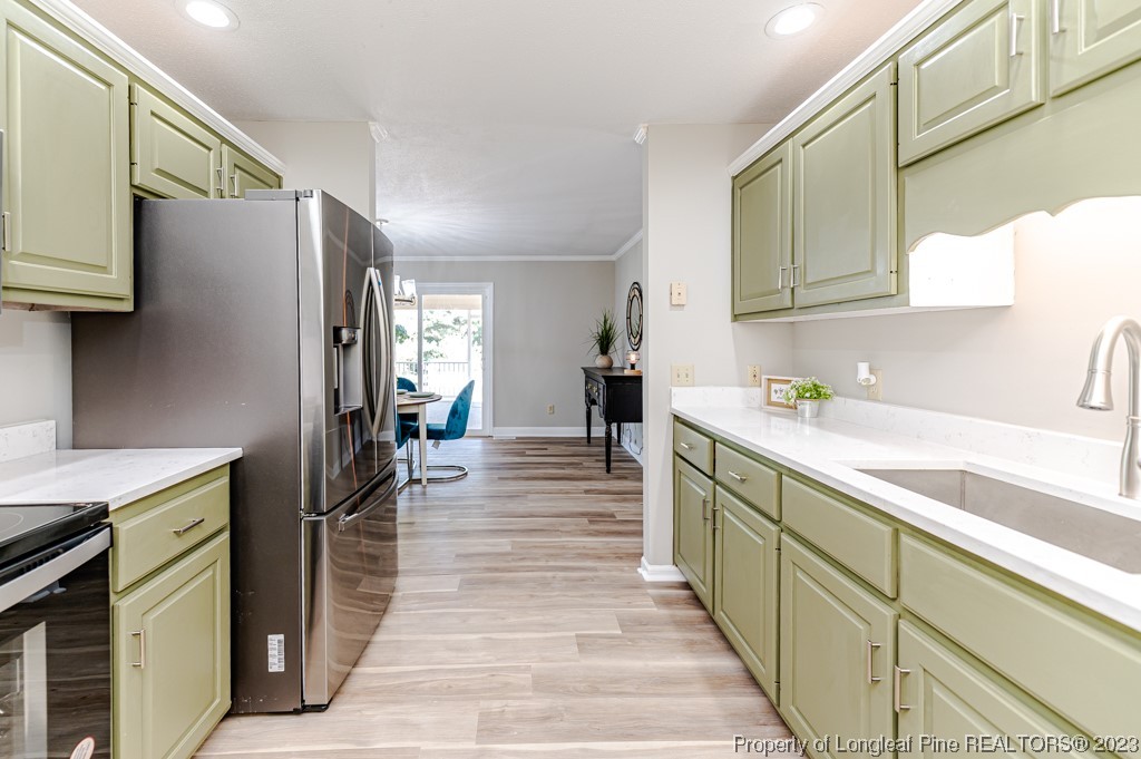 4286 Nicholson Road Cameron, NC 28326 - Photo 15 of 50 a kitchen with stainless steel appliances a refrigerator and a sink