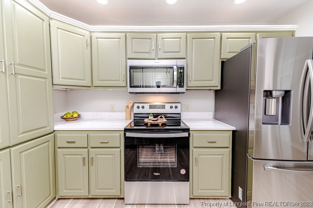 4286 Nicholson Road Cameron, NC 28326 - Photo 16 of 50 a kitchen with stainless steel appliances granite countertop a refrigerator stove and sink