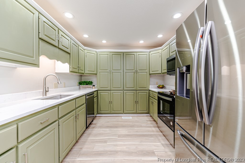 4286 Nicholson Road Cameron, NC 28326 - Photo 17 of 50 a kitchen with sink a refrigerator and a sink