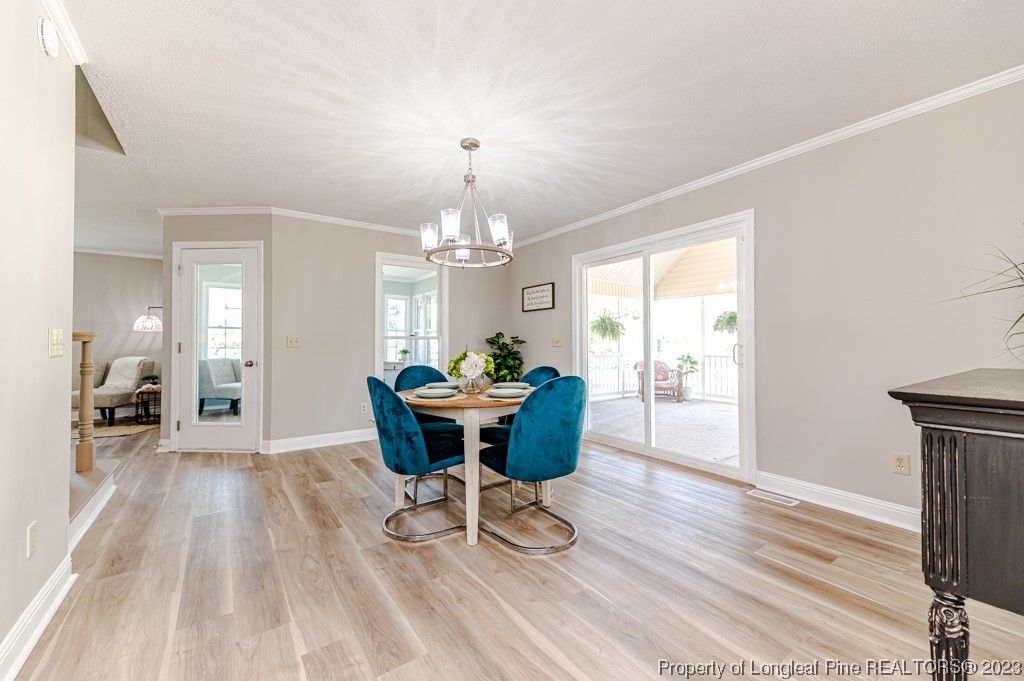 4286 Nicholson Road Cameron, NC 28326 - Photo 18 of 50 a view of a dining room with furniture window and wooden floor