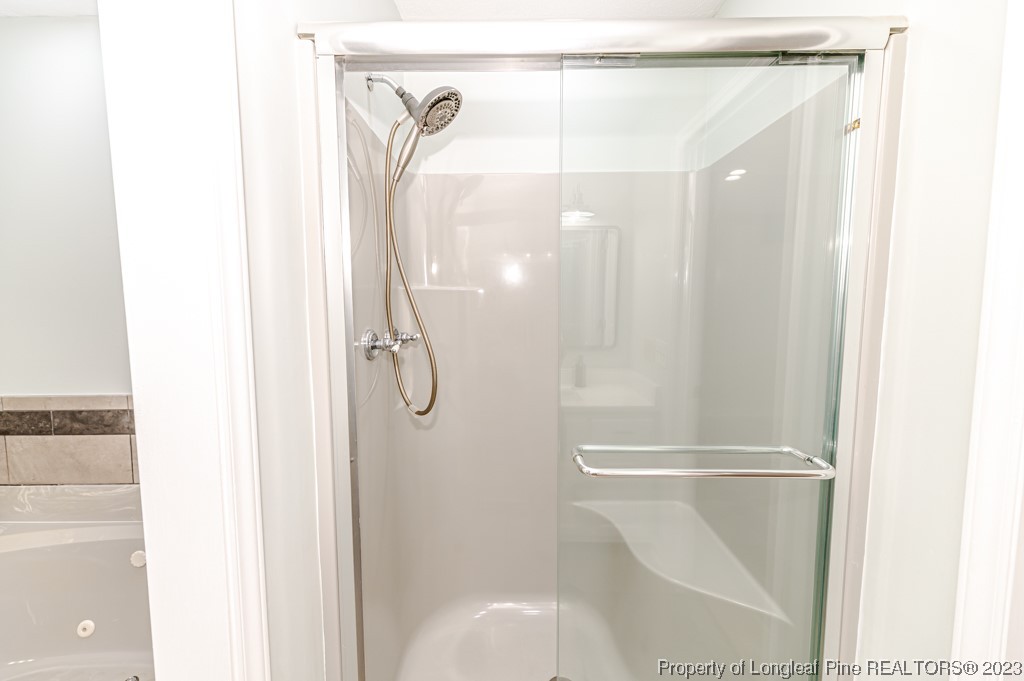 4286 Nicholson Road Cameron, NC 28326 - Photo 20 of 50 a bathroom with a glass shower door