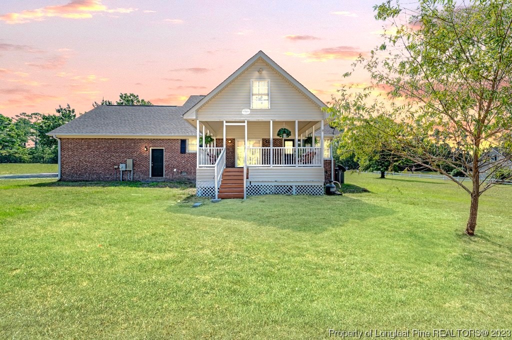 4286 Nicholson Road Cameron, NC 28326 - Photo 2 of 50 a front view of a house with a garden and trees
