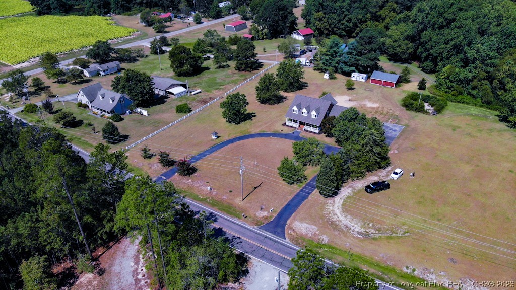 4286 Nicholson Road Cameron, NC 28326 - Photo 3 of 50 an aerial view of a house with a yard and lake view