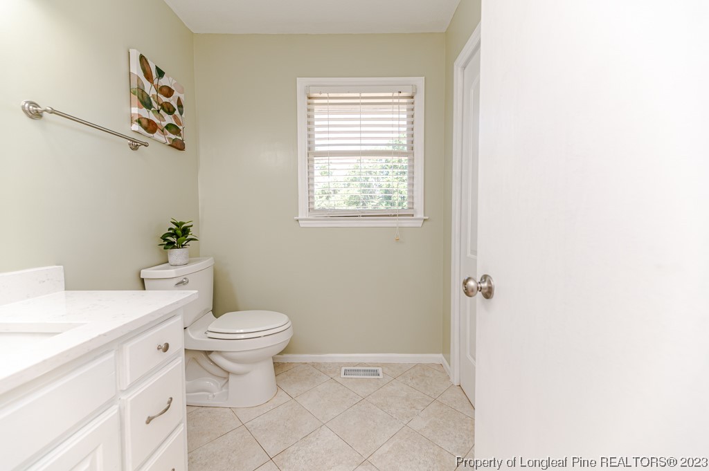 4286 Nicholson Road Cameron, NC 28326 - Photo 33 of 50 a bathroom with a toilet a sink and a window
