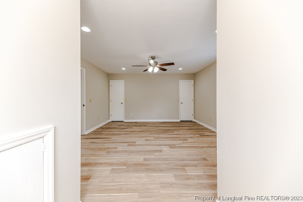 4286 Nicholson Road Cameron, NC 28326 - Photo 37 of 50 a view of a hallway with wooden floor