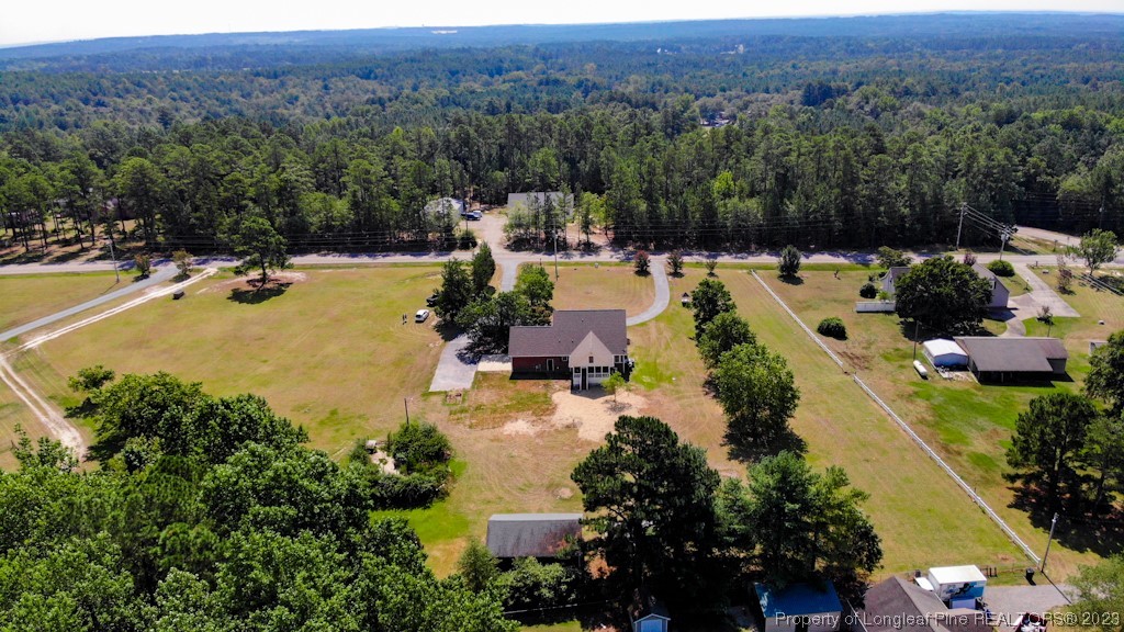 4286 Nicholson Road Cameron, NC 28326 - Photo 4 of 50 a view of a swimming pool with a yard