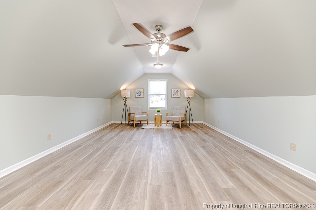 4286 Nicholson Road Cameron, NC 28326 - Photo 45 of 50 a view of an empty room with wooden floor and a ceiling fan