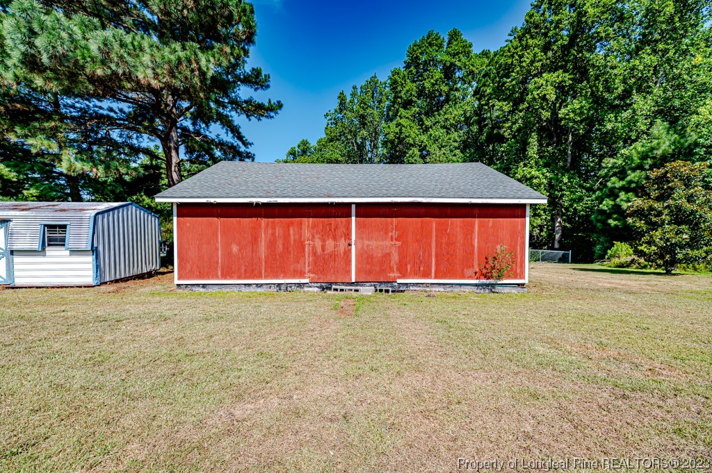 4286 Nicholson Road Cameron, NC 28326 - Photo 48 of 50 a backyard of a house with lots of green space