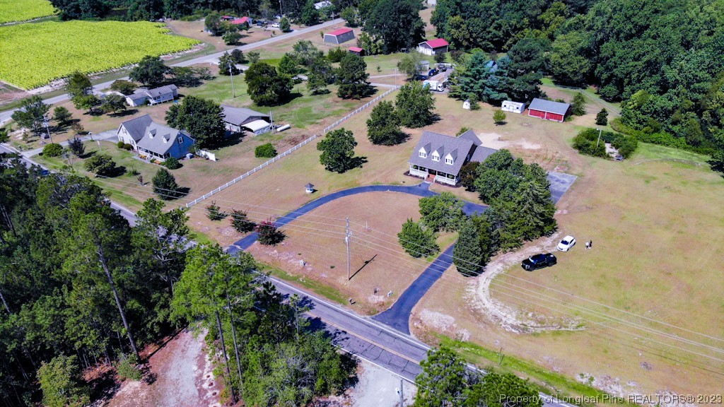 4286 Nicholson Road Cameron, NC 28326 - Photo 5 of 50 an aerial view of a house with a yard and lake view