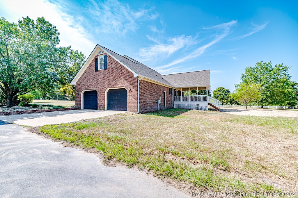 4286 Nicholson Road Cameron, NC 28326 - Photo 10 of 50 a house with trees in the background