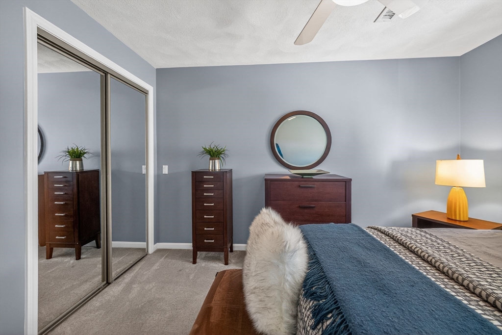 22 McRayne Hill Road Billerica, MA 01821 - Photo 12 of 42 a bedroom with a bed and a dresser