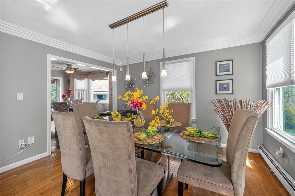 22 McRayne Hill Road Billerica, MA 01821 - Photo 14 of 42 a view of a dining room with furniture and a chandelier