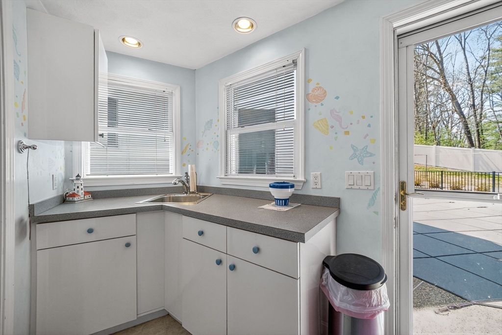 22 McRayne Hill Road Billerica, MA 01821 - Photo 18 of 42 a kitchen with a sink and a window