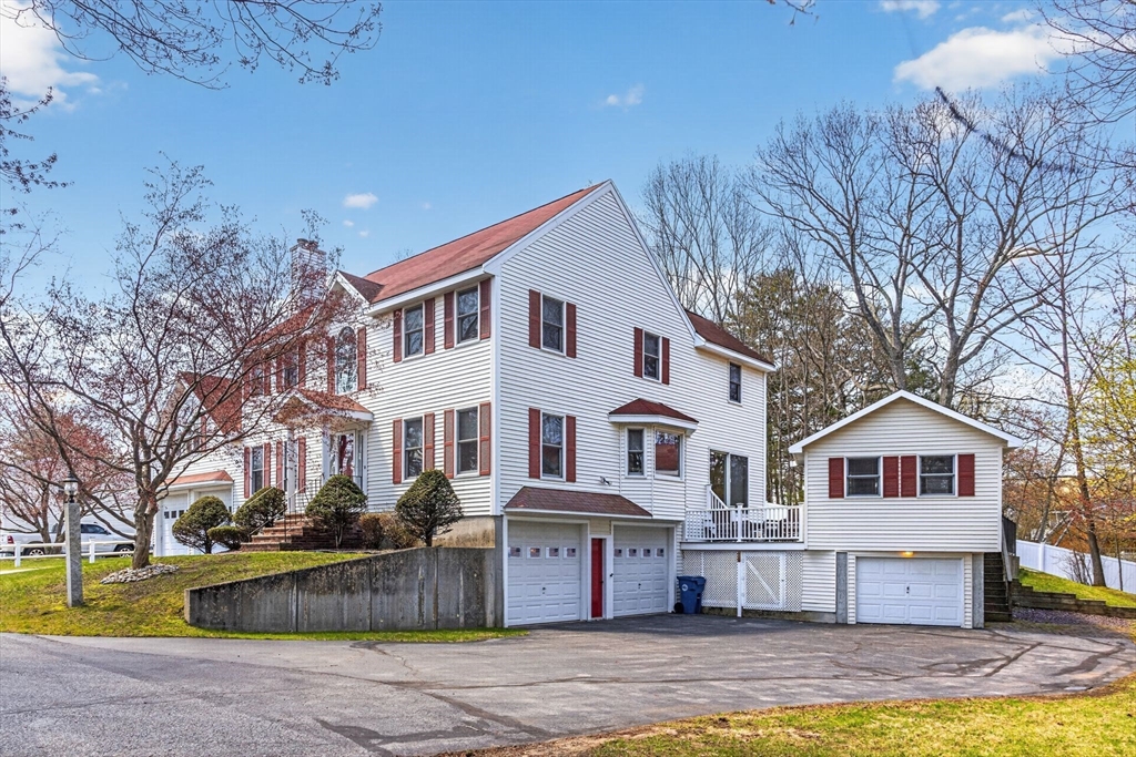 22 McRayne Hill Road Billerica, MA 01821 - Photo 2 of 42 a front view of a house with swimming pool