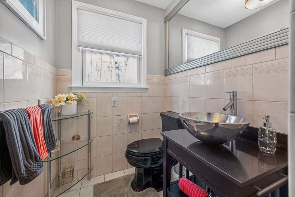 22 McRayne Hill Road Billerica, MA 01821 - Photo 21 of 42 a bathroom with a sink and a mirror