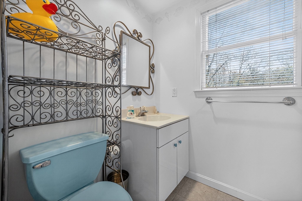 22 McRayne Hill Road Billerica, MA 01821 - Photo 25 of 42 a bathroom with a sink a toilet and shower