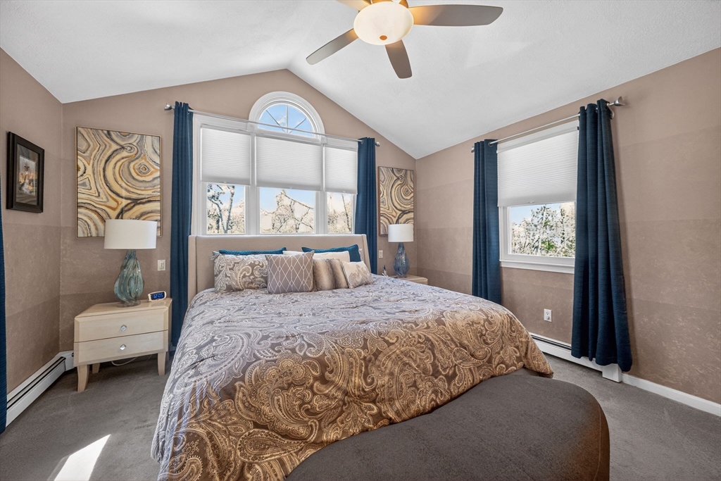 22 McRayne Hill Road Billerica, MA 01821 - Photo 28 of 42 a bedroom with a bed and a painting on the wall