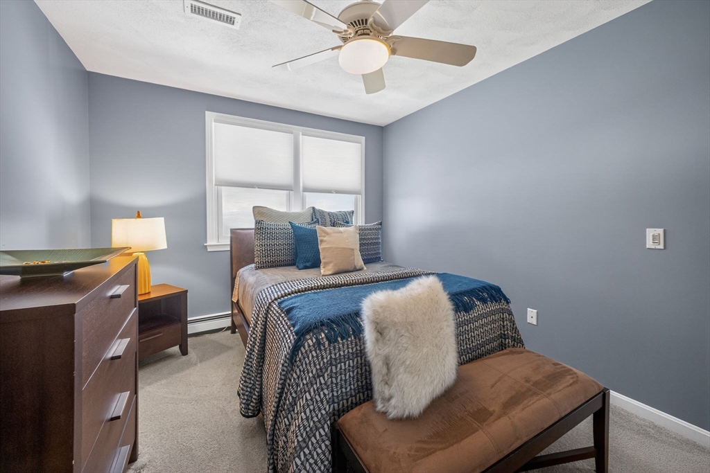 22 McRayne Hill Road Billerica, MA 01821 - Photo 30 of 42 a bedroom with a bed and window