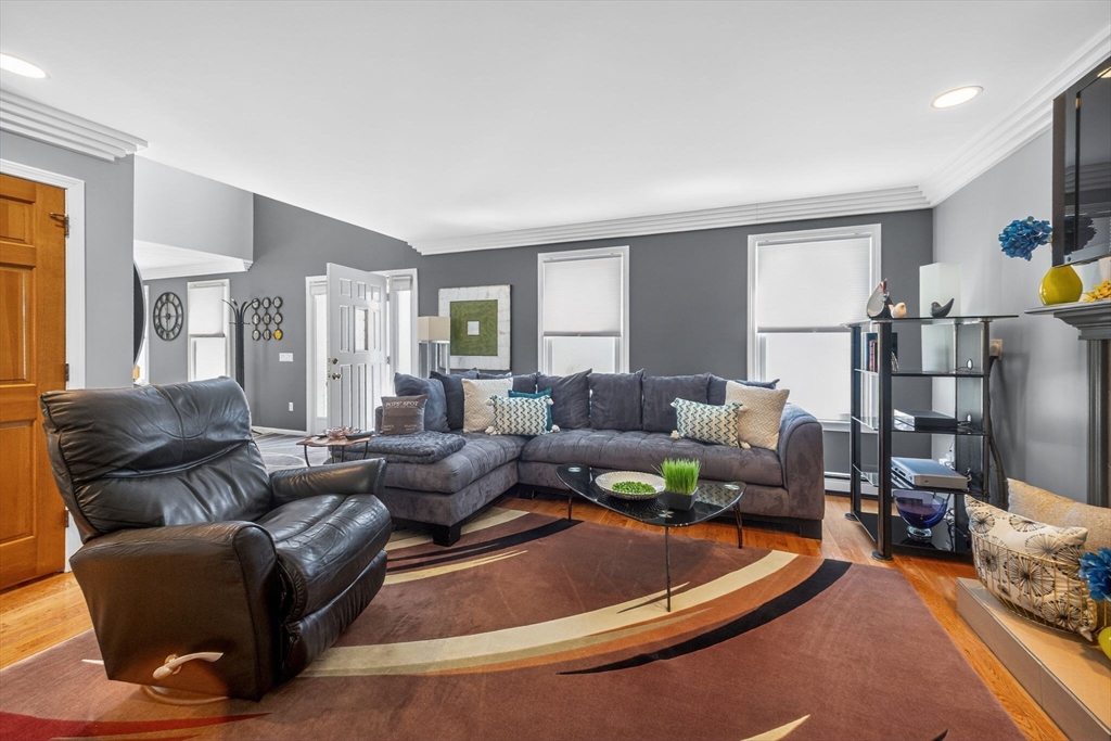 22 McRayne Hill Road Billerica, MA 01821 - Photo 33 of 42 a living room with furniture and a wooden floor