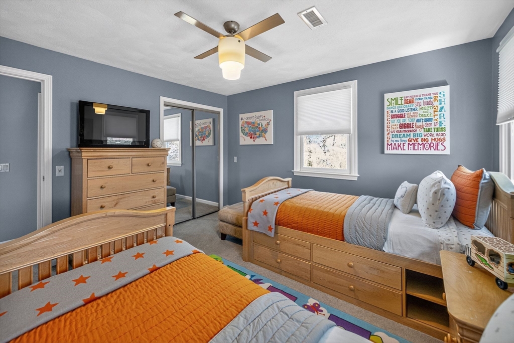 22 McRayne Hill Road Billerica, MA 01821 - Photo 37 of 42 a bedroom with a bed and furniture