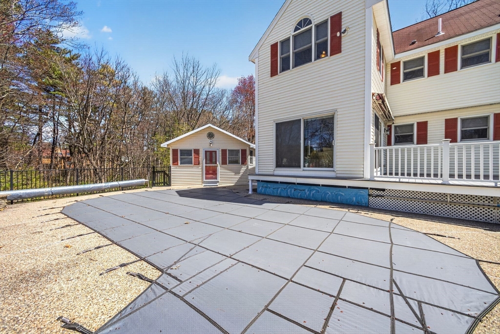 22 McRayne Hill Road Billerica, MA 01821 - Photo 40 of 42 a front view of a house with a yard