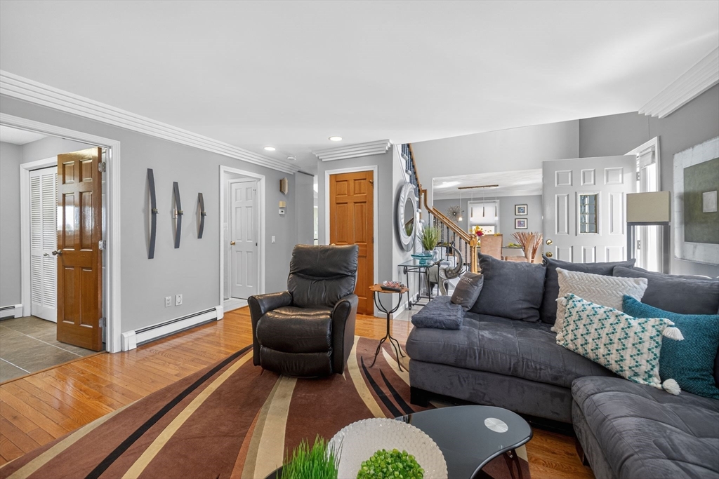 22 McRayne Hill Road Billerica, MA 01821 - Photo 9 of 42 a living room with furniture or couch and a wooden floor