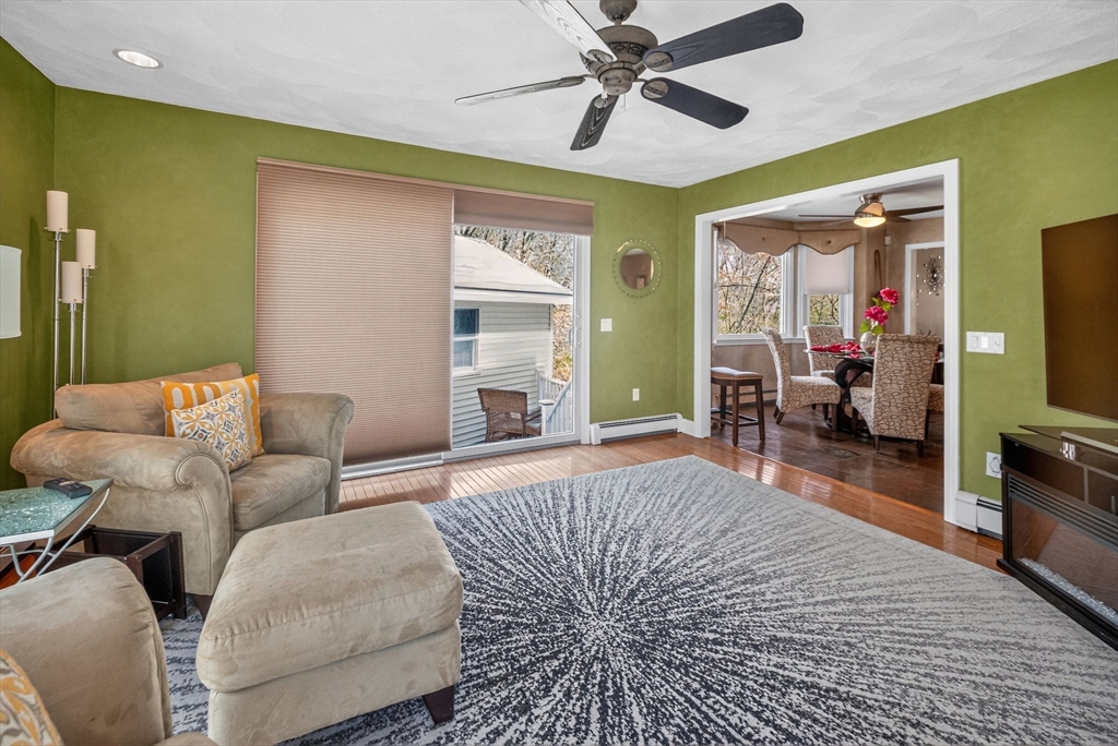 22 McRayne Hill Road Billerica, MA 01821 - Photo 10 of 42 a living room with furniture and a flat screen tv