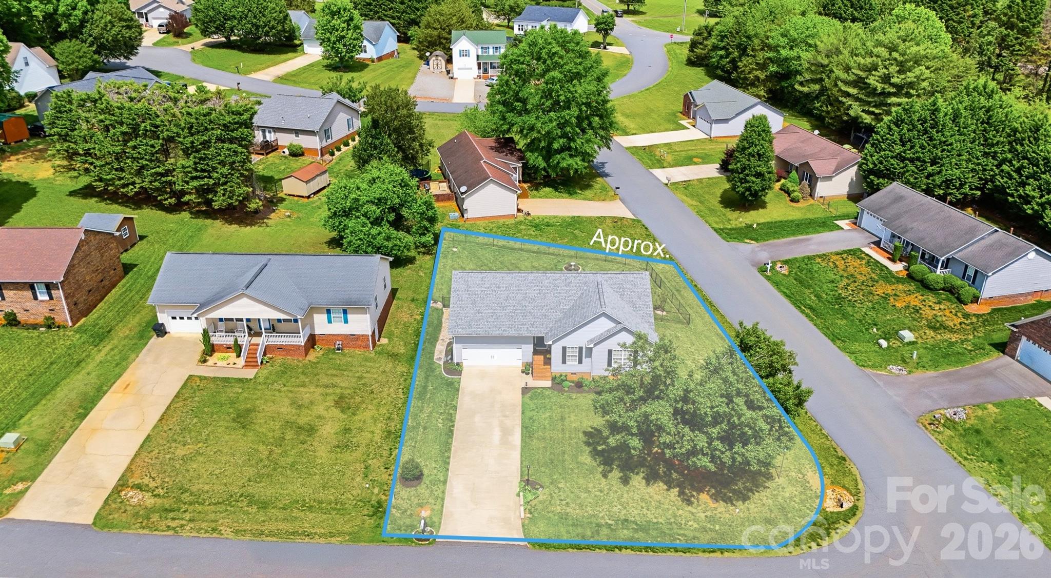 2104 Sheffield Court Northwest Conover, NC 28613 - Photo 22 of 25 an aerial view of a house with a yard and lake