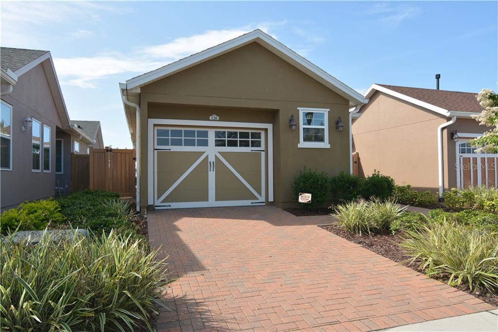 126 Bayou Bend Road Groveland, FL 34736 - Photo 1 of 1 a front view of a house with garden