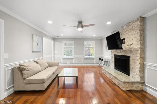 a living room with furniture fireplace and flat screen tv