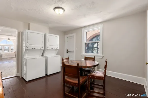 a view of a dining room with furniture and window