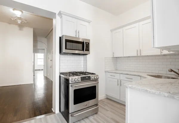 a kitchen with a stove and a microwave
