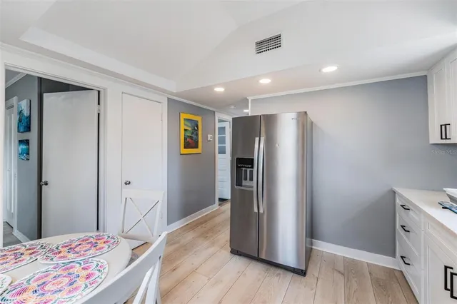 a view of a bedroom with wooden floor and closet