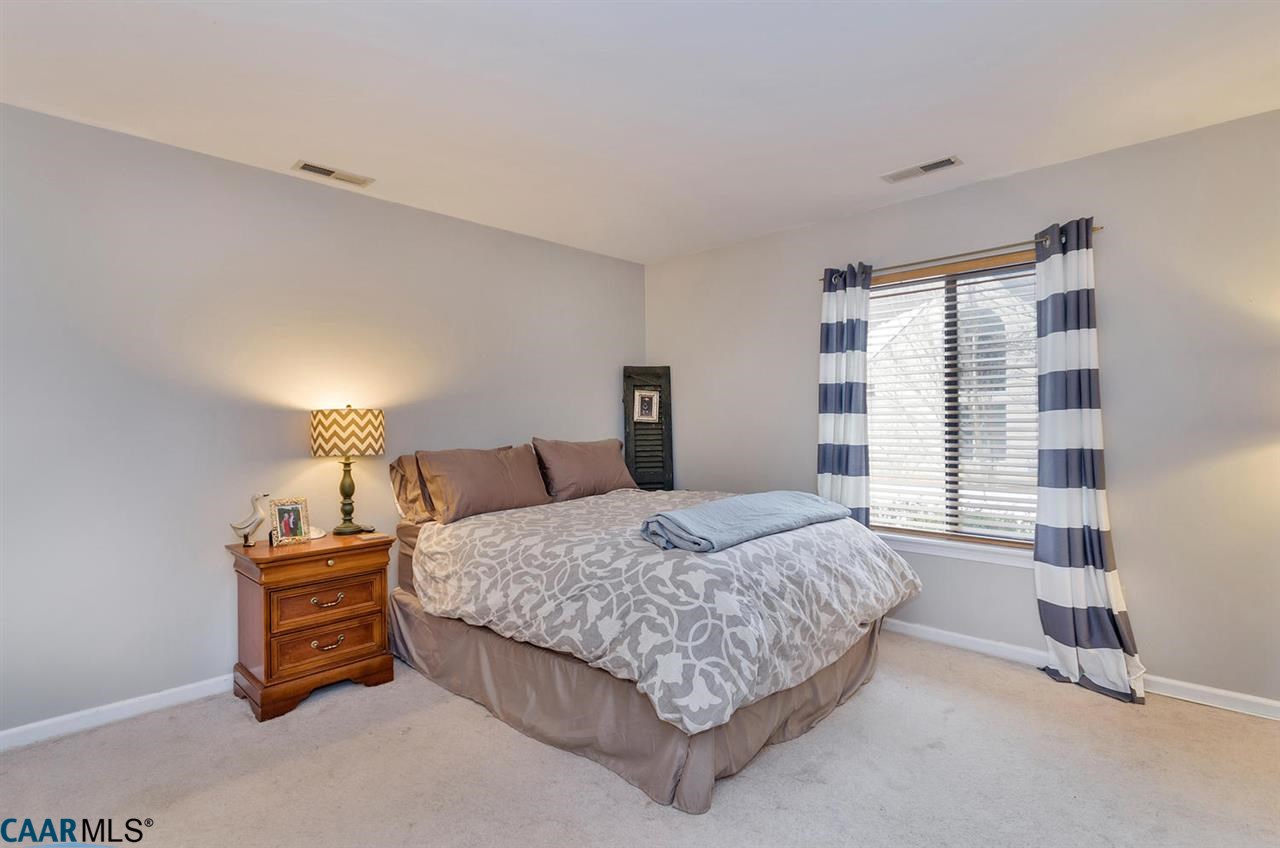 1084 Amber Ridge Road Charlottesville, VA 22901 - Photo 16 of 20 a bedroom with a bed and a night stand