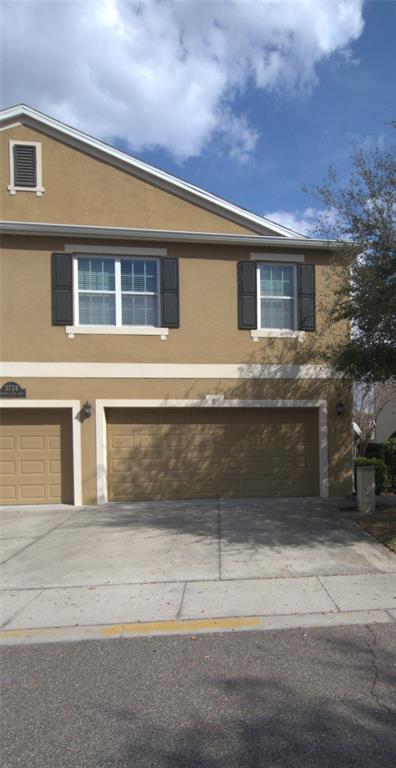 3724 Seneca Club Loop, Unit 41103 Orlando, FL 32808 - Photo 1 of 27 a view of a house with a yard