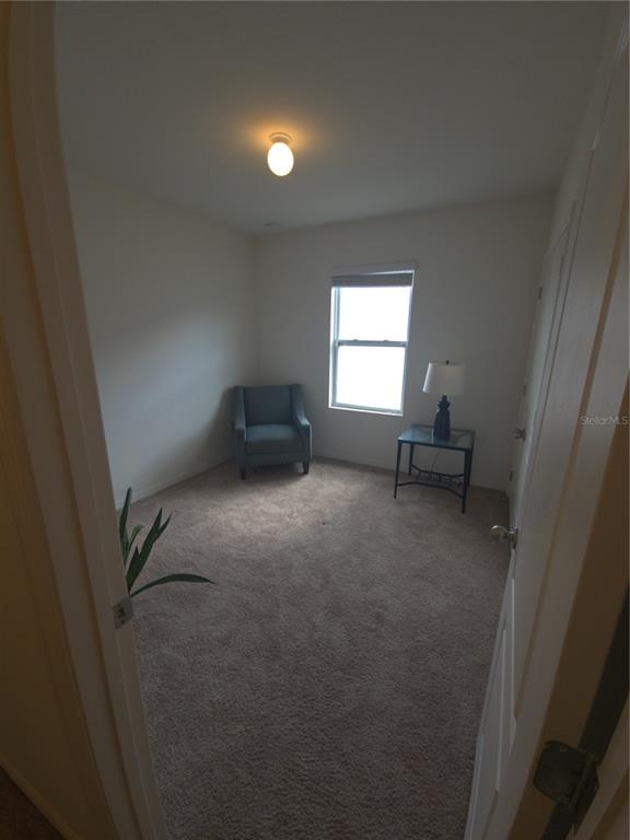 3724 Seneca Club Loop, Unit 41103 Orlando, FL 32808 - Photo 18 of 27 a view of livingroom with furniture and window