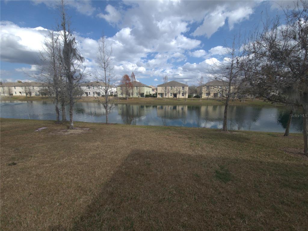 3724 Seneca Club Loop, Unit 41103 Orlando, FL 32808 - Photo 27 of 27 a view of lake with green space