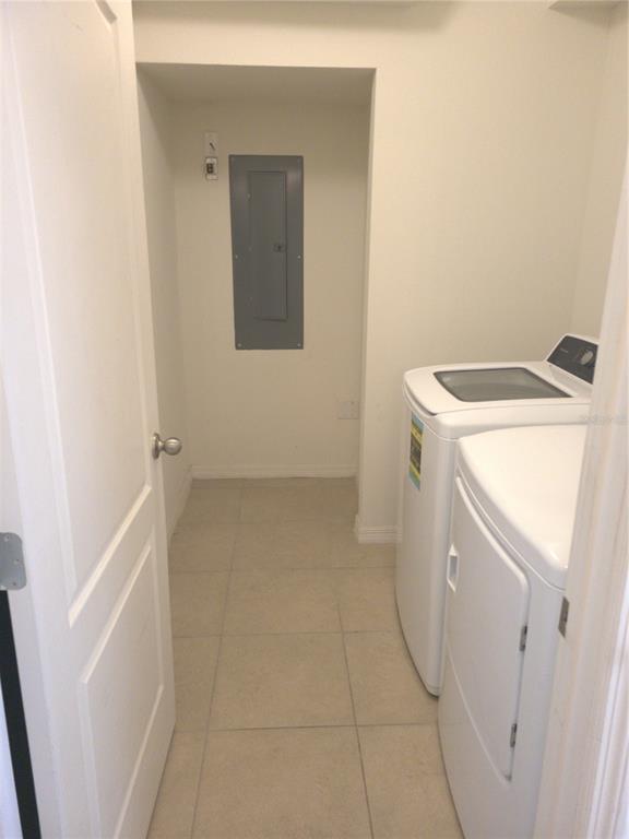 3724 Seneca Club Loop, Unit 41103 Orlando, FL 32808 - Photo 9 of 27 a utility room with dryer and washer
